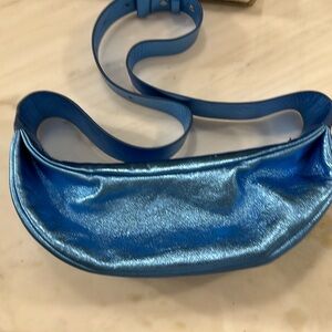 Never been worn, COS sling bag in metallic blue. No longer available.